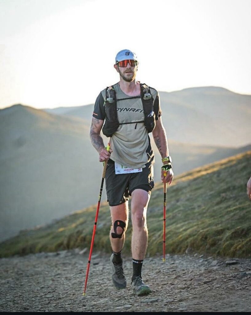 Jordan Collins Ultra Trail Runner ML and Crib Goch Outdoor Trail Running Expert Racing uphill with trail running poles